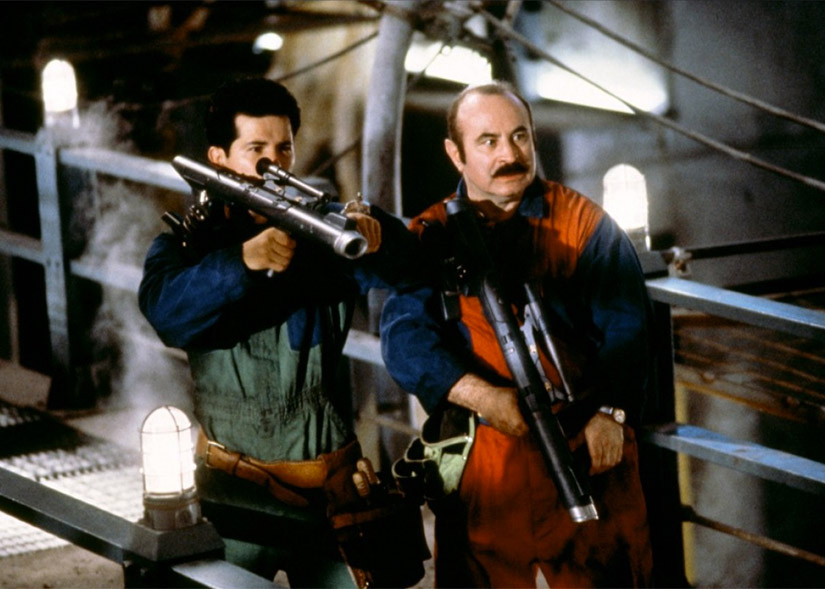 Film still of Bob Hoskins, John Leguizamo in Super Mario Bros.
