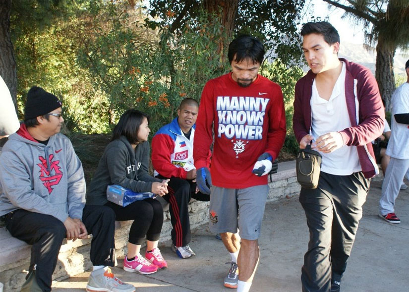 Behind the scenes shot of Ryan Moore and Manny Pacquiao during filming of Manny
